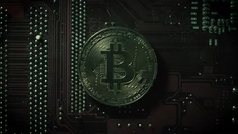 One bitcoin on the background of microboards. close-up Stock Footage 147087655