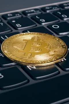One bitcoins on a computer keyboard closeup Foto stock