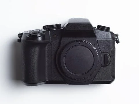 One black camera isolated on white background. intact mirorles camera with .. Stock Photos