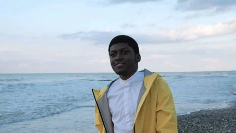 One black guy in color clothes smiling and spending time by go and dancing on sh Stock Footage 199493014