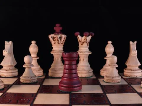 One black tower is facing the queen and the king Stock Photos