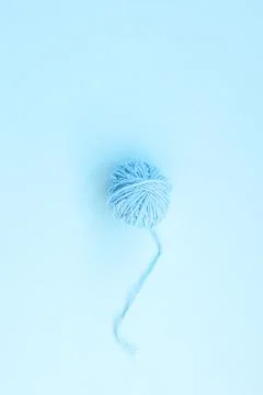 One blue ball of woolen thread on a light background Stock Photos