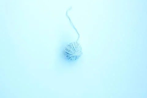 One blue ball of woolen thread on a light background Stock Photos