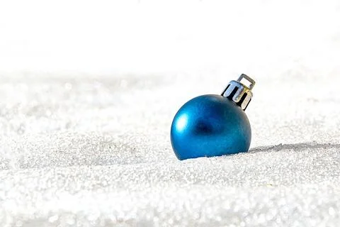 One blue christmas tree ball on white snow Stock Photos