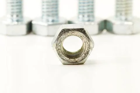 One bolt in front of four Stock Photos