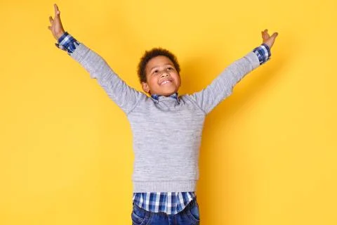One boy studio isolated on yellow wall dreams come true Stock Photos