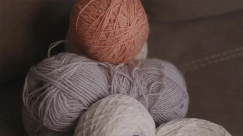 One bright yarn ball among neutral threads symbolic leadership concept Stock Footage 337452084
