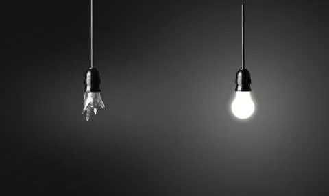 One broken and one glowing bulb. idea concept on black background Stock Photos