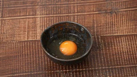 One broken egg on the plate Stock Footage 183495833