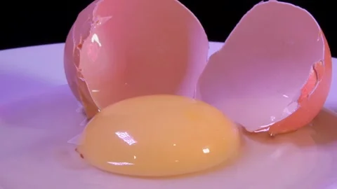 One broken raw chicken egg Stock Footage 154255426