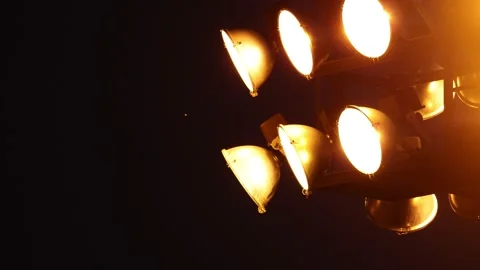 One bug flying near a large light array at night Stock Footage 159722547