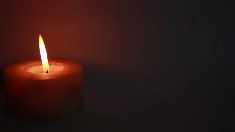 One burning candles in the dark Stock Footage 146042458