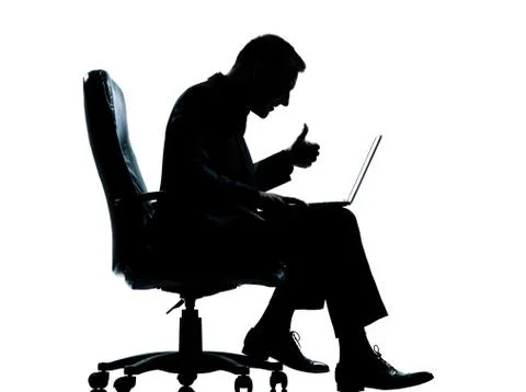 One business man computing silhouette thumb up Stock-Fotos