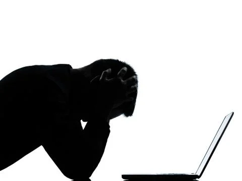One business man silhouette computing computer laptop despair sad Stock-Fotos