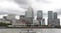 One Canada Square Financial District London England Tour Boat Passing Ferry Dock HD Footage