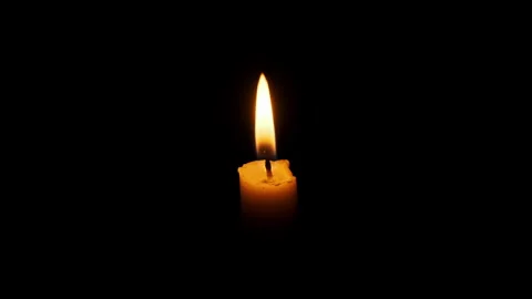 One Candle Burning and Extinguished on a Black Background, Copy Space Video stock 262568086