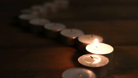 One candle flame glowing in the dark, create a spiritual atmosphere Stock Footage 108067190