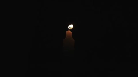 One Candle flame lights isolated on a black background. Stock Footage 278364056