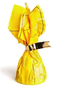 One candy cane in a yellow wrapping with a silver ribbon Foto stock