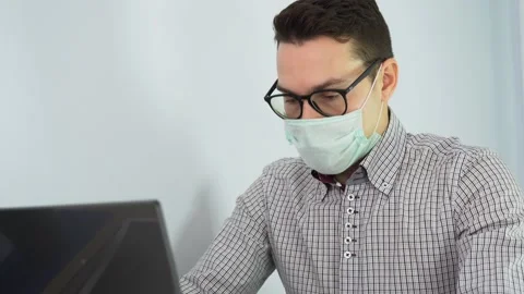 One Caucasian guy works remote, use laptop, typing on home background close up Video stock 131473276