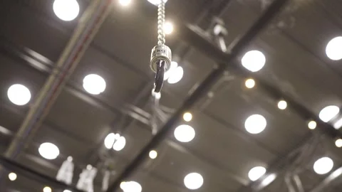One Chained Hook being Raised by Motorized Hoist Stock Footage 262111732