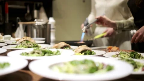 One chef roasts salmon with a gas burner. Stock Footage 231159532