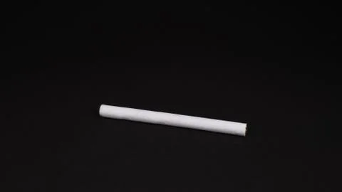 One cigarette on a black background Foto stock