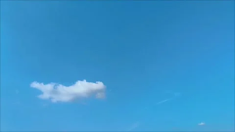 One cloud over vast blue sky in Jakarta Stock Footage 312104997