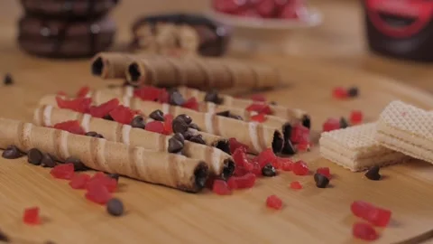 One crispy wafer stick filled with chocolate or cocoa falling on other roll t... Stock Footage 153199746