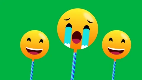 One crying and two laughing emoji stick in swinging motion isolated on gree.. Stock Footage 270451277