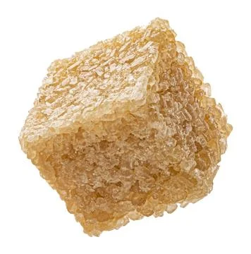 One cube of cane sugar isolated on white background Stock Photos