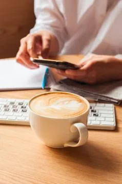 One cup of coffee on a working table. Stock Photos