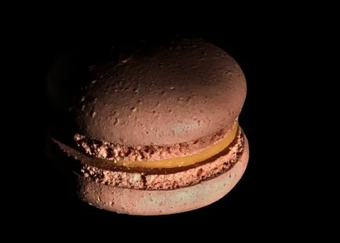 One a darkened beige macaroon Stock Photos