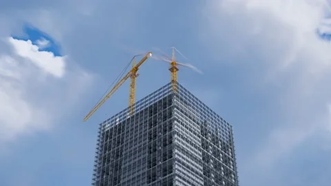 One-day timelapse of a tall skyscraper being built by construction cranes. 4K HD Stock Footage 202283592
