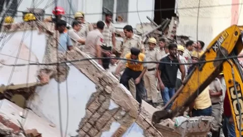 One dead and several missing after five-story building collapses in New Delhi, N Stock Footage 344819358