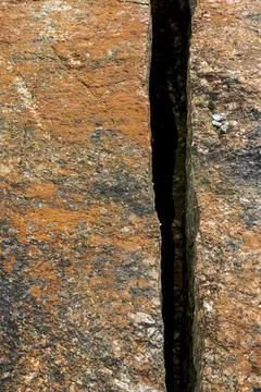 One deep , straight sharp crack on bedrock surface 写真素材