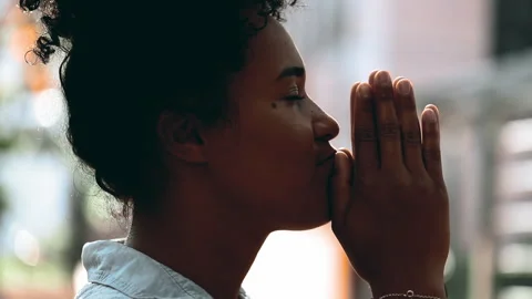 One Devout Young Black Female in Prayerful Contemplation, Profile Close-Up .. Stock Footage 267285250