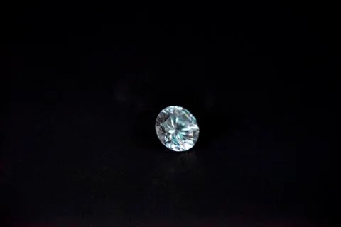 One diamond of classic shape on the black background Stock Photos