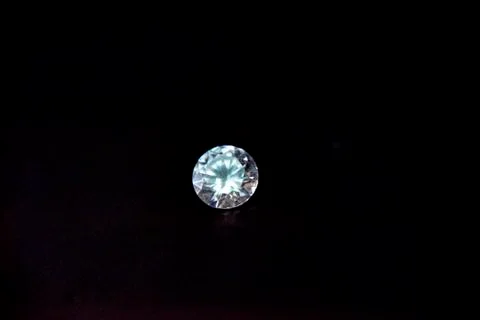 One diamond of classic shape on the black background Stock Photos