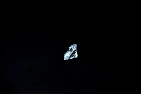 One diamond of classic shape on the black background Stock Photos