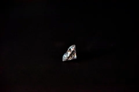 One diamond of classic shape on the black background Stock Photos