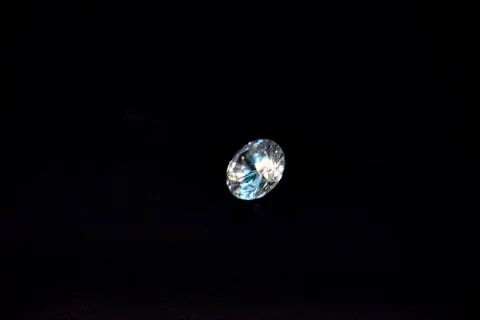 One diamond of classic shape on the black background Stock Photos