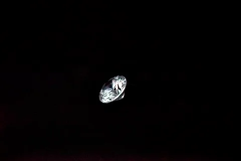 One diamond of classic shape on the black background Stock Photos