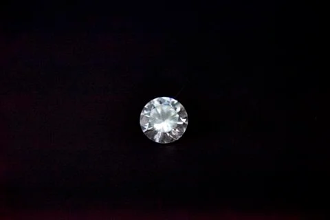 One diamond of classic shape on the black background Stock Photos