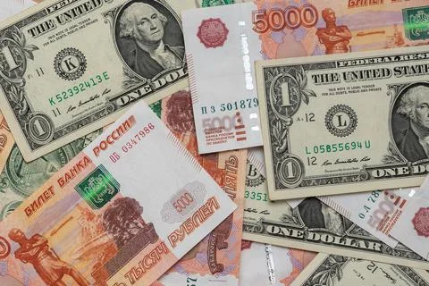 One dollar and five thousand rubles cash banknotes. Business concept Foto stock