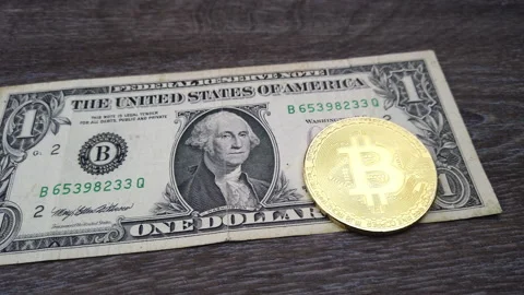 One dollar bill and one bitcoin coin Stock Footage 161837826