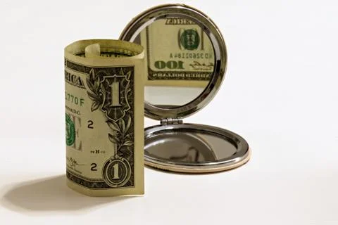 One dollar bill with blurred reflection in lady mirror one hundred dollars Stock Photos