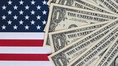 One dollar bill on flag Stock Photos
