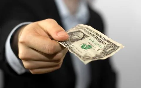 One Dollar Bill in hand Stock Photos