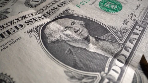One dollar bill rotates on a table 動画素材 121877846